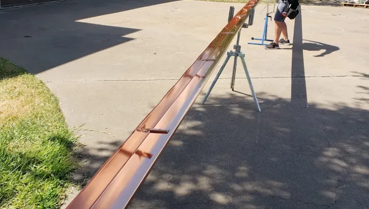 Tracy fabricating seamless gutters on-site using a truck-mounted gutter machine in Joshua, TX