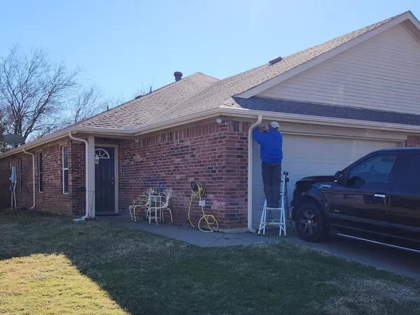 Gutter installation in progress on a brick ranch home in Cleburne, TX (January 2026)